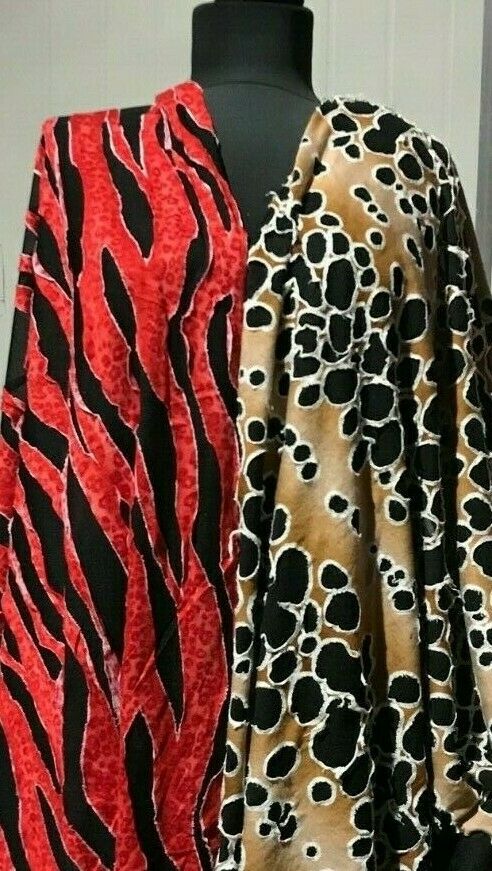 FABRIC JERSEY TEARED VISCOSE JERSEY SEWED ON THIN BLACK POLYESTER -SOLD BY METER